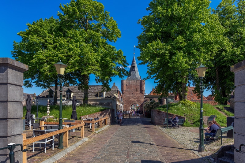 Elburg, Netherlands street with gate and trees