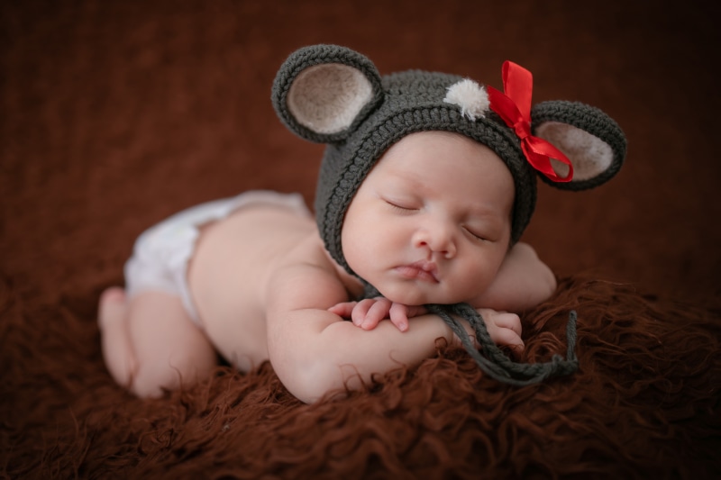 Baby wearing a mouse hat sleeping
