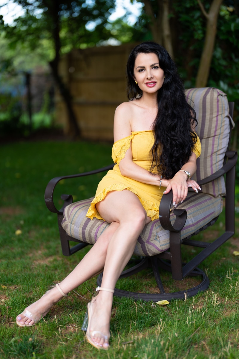 Victoria Bell sitting in an armchair outdoors