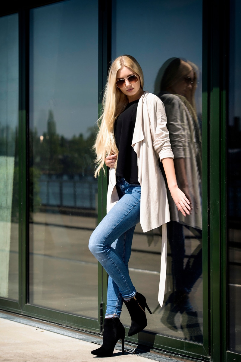 Soraya, Miss Germany 2017, posing in jeans and sunglasses