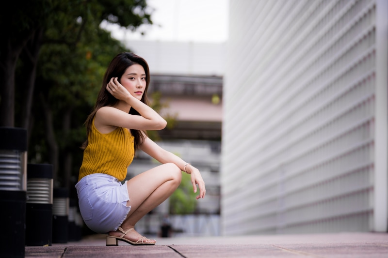 Asian woman posing outdoors