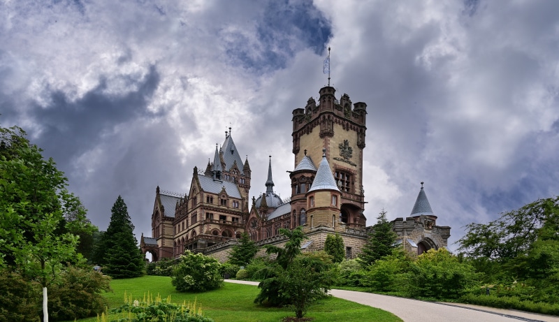 Schloss Drachenburg castle with towers under cloudy sky