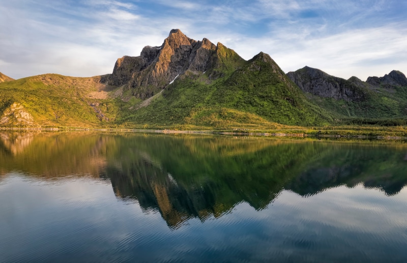 Mountains reflecting in a fjord in Lofoten, Norway
