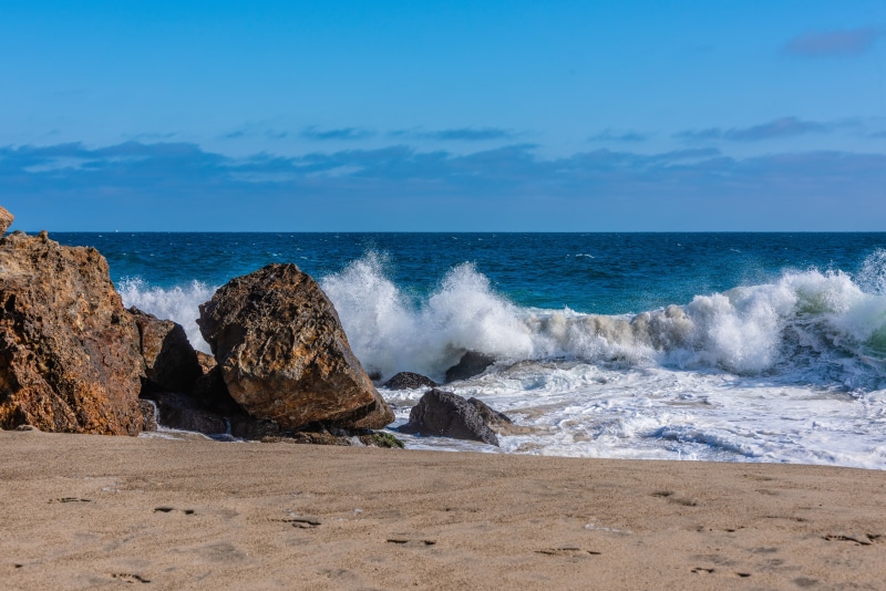 Waves crashing on rocks at Point Dume in Malibu, California
