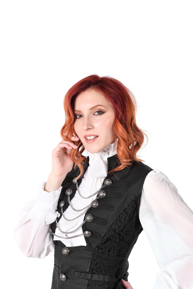 Redhead woman in gothic attire with chains