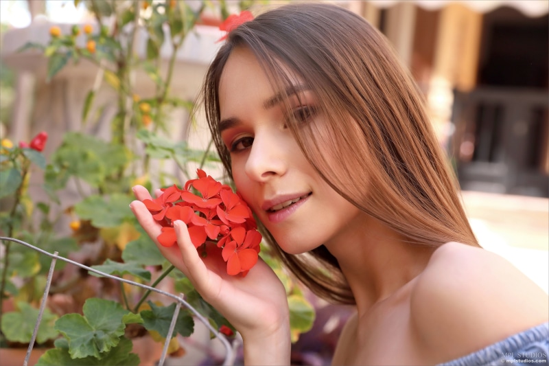 Leona Mia with red flowers