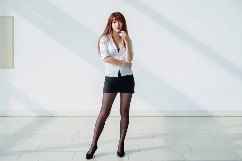 Asian Woman in Blouse and Skirt