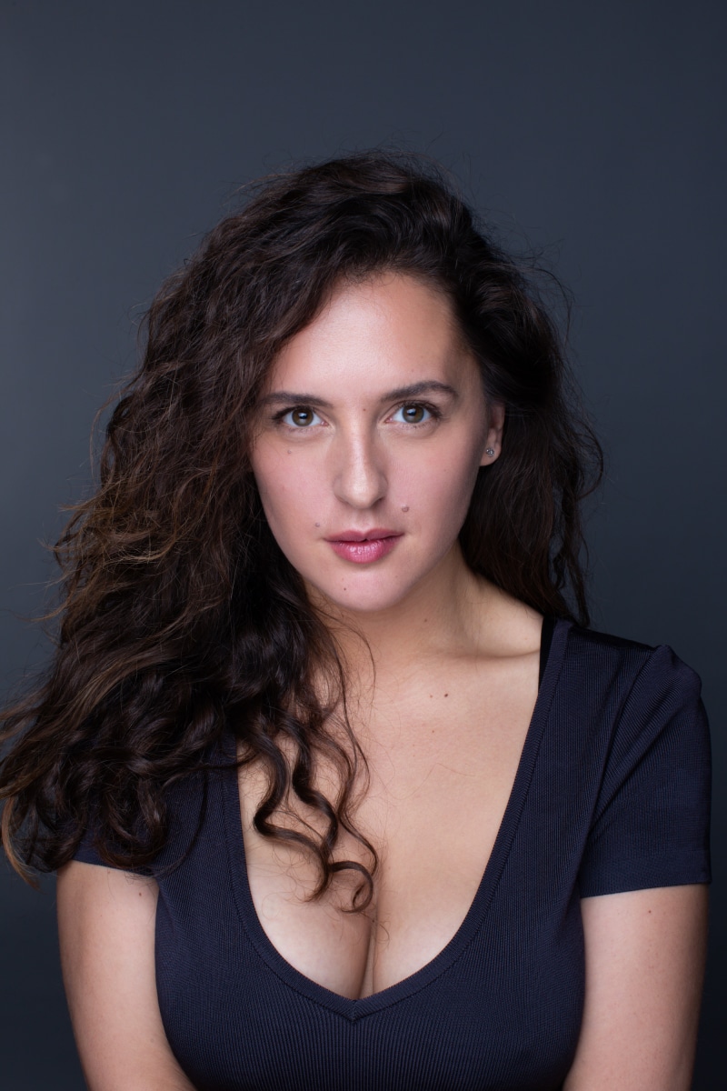 Maria Shumakova with curly brunette hair