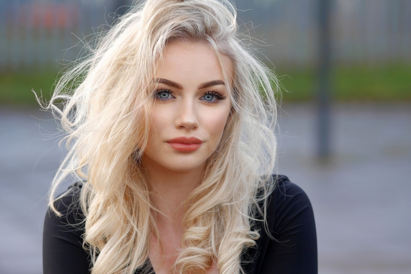 Blonde woman with blue eyes and makeup
