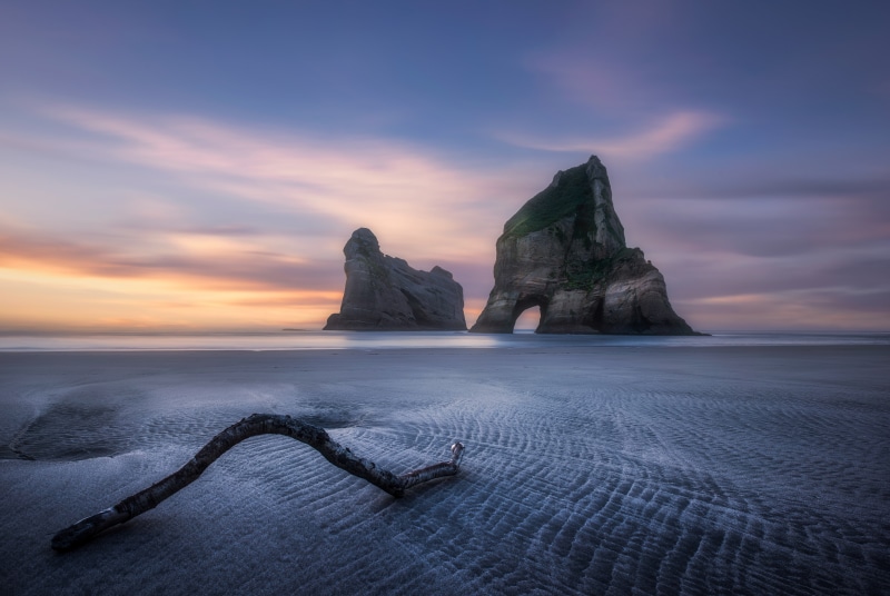 Wharariki Beach, New Zealand Coast at Sunset