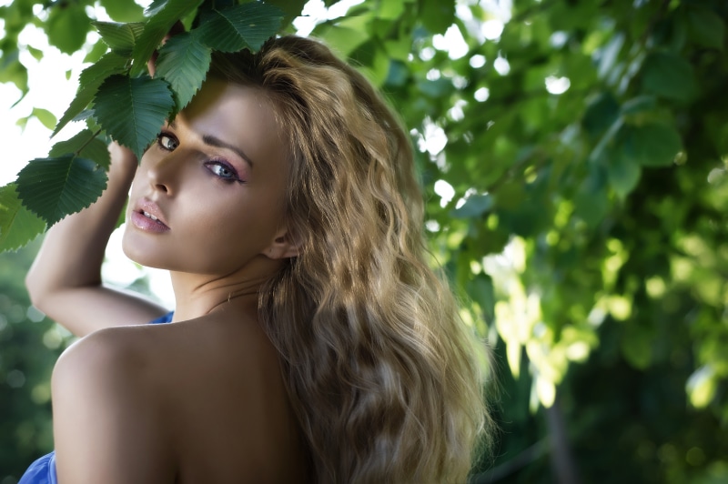 Blonde girl with foliage