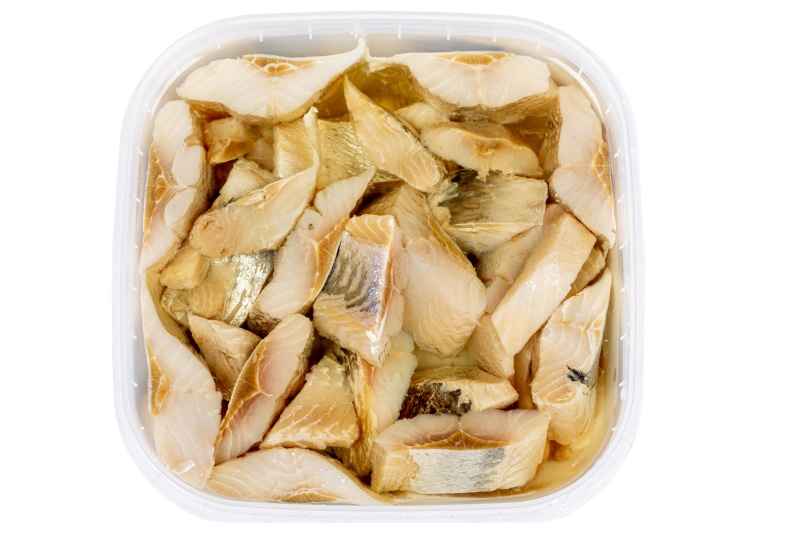 Pieces of fish in a plastic container