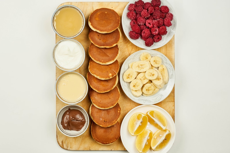 Pancakes with Raspberries, Bananas, and Condiments