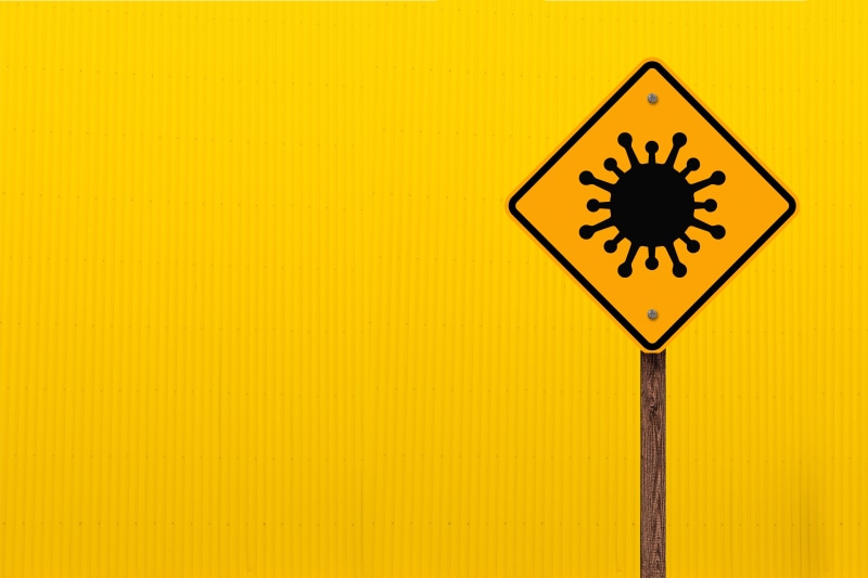 Coronavirus warning sign on yellow background