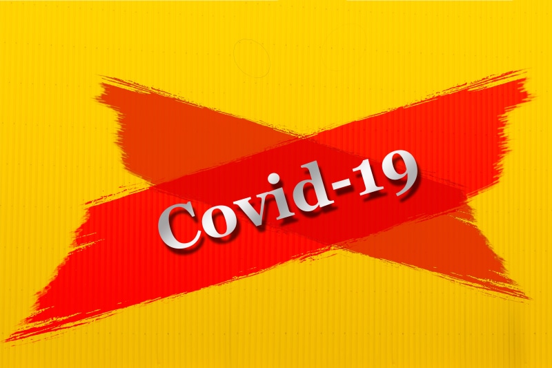 Covid-19 text on red cross shape