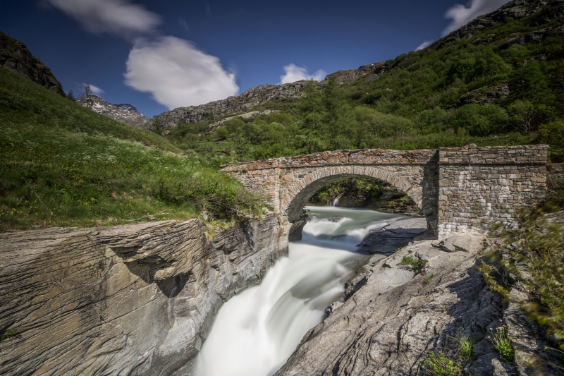 Stone bridge over a river in the mountains