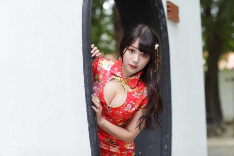 Asian woman in a red floral dress