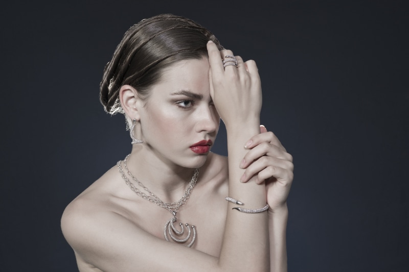 Woman with diamond jewelry and red lipstick