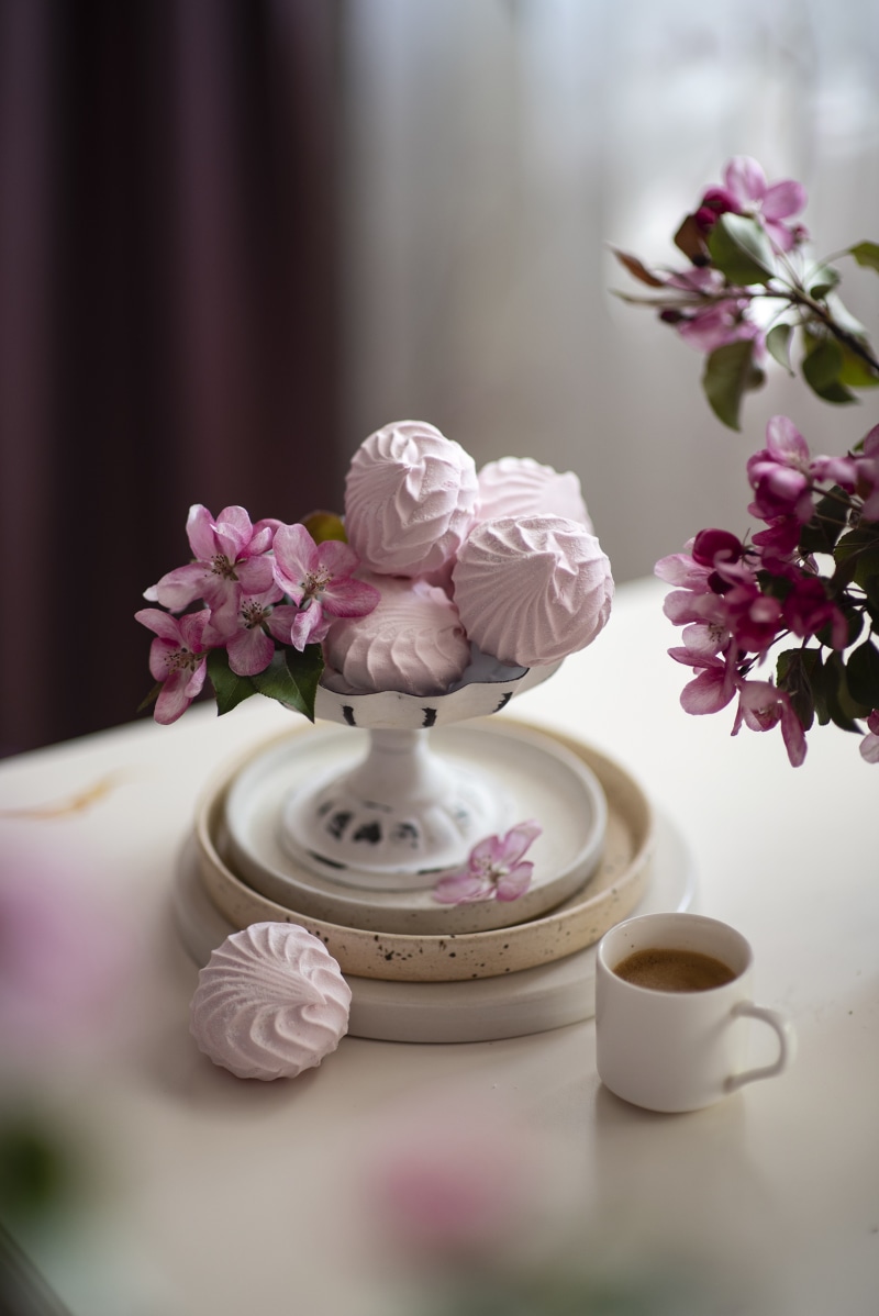 Pink Zefir marshmallows with apple blossoms and coffee