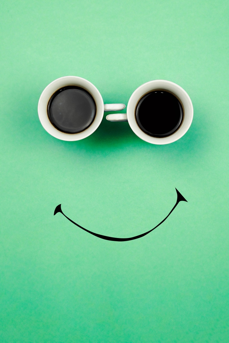 Two coffee cups forming a smiley face
