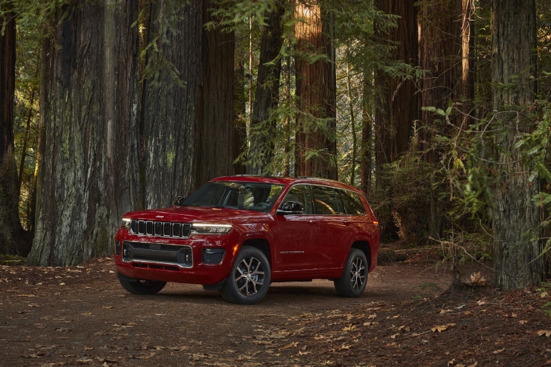 Red Jeep Grand Cherokee L Overland in Forest