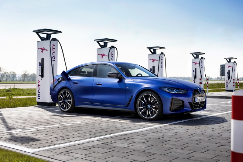 Blue BMW i4 M50 charging at Ionity station