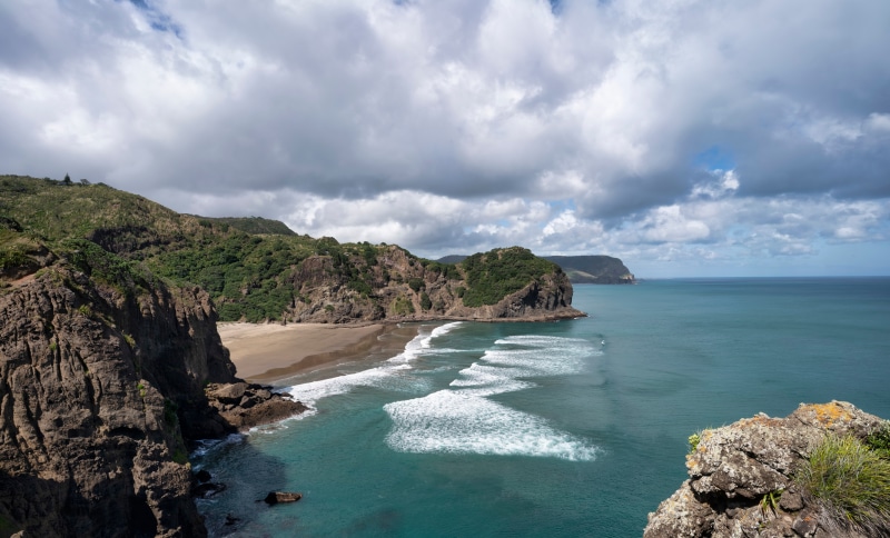 New Zealand Coastline with Craggy Cliffs and Waves