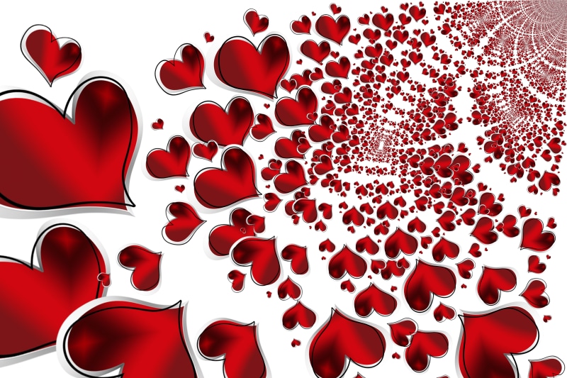 Many red hearts on white background