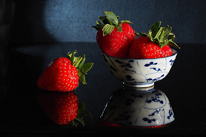 Strawberries in a bowl with reflection