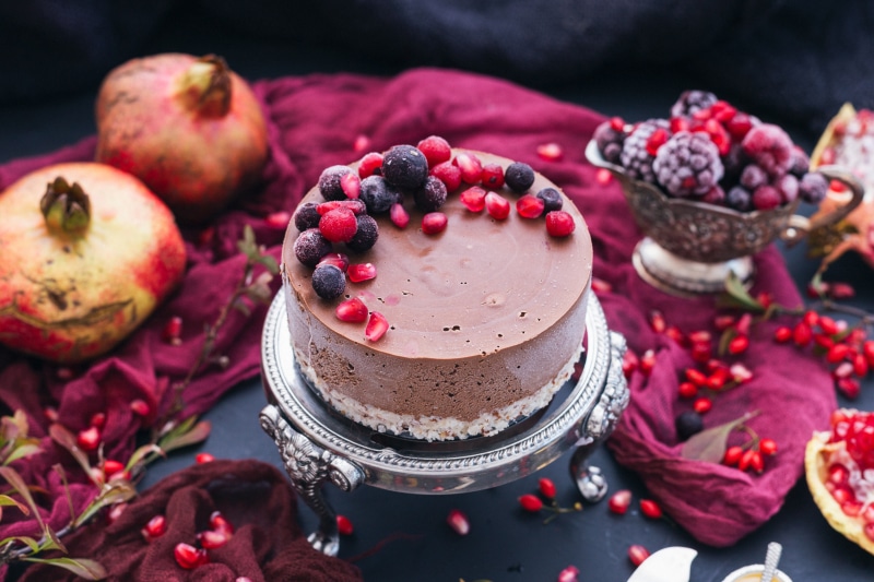 Chocolate cake with berries and pomegranate