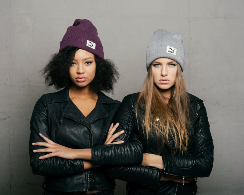 Sainabou and Vanessa wearing Puma winter hats and leather jackets
