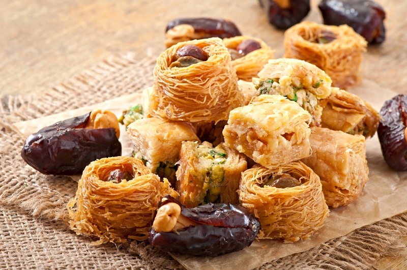 Baklava and dates on burlap