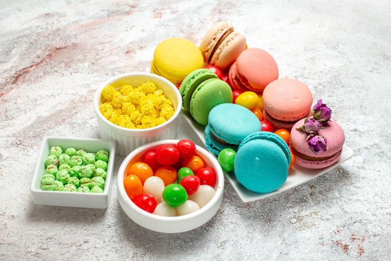 Assortment of colorful macarons and candies