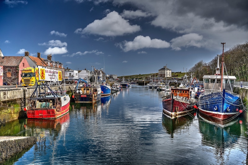 Eyemouth Harbour, Scotland with fishing boats and buildings