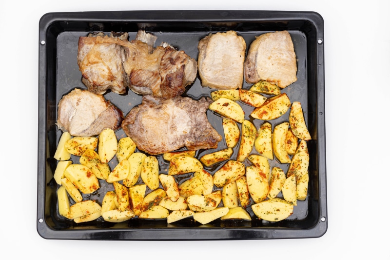 Roasted Pork Chops and Potatoes on Baking Sheet
