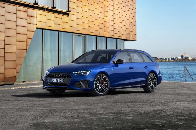 Blue Audi A4 Avant S line competition plus parked by water