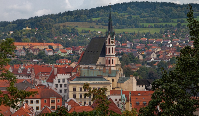 Church tower and houses in Cesky Krumlov, Czech Republic