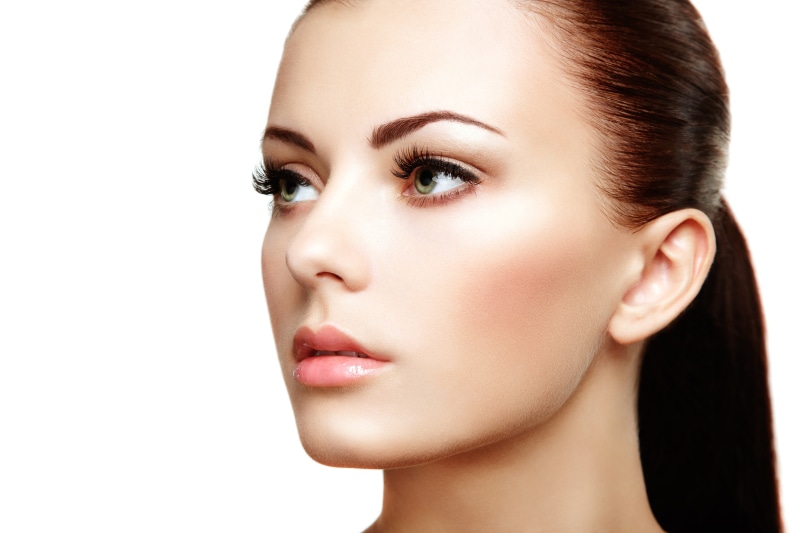 Brunette woman with green eyes and makeup