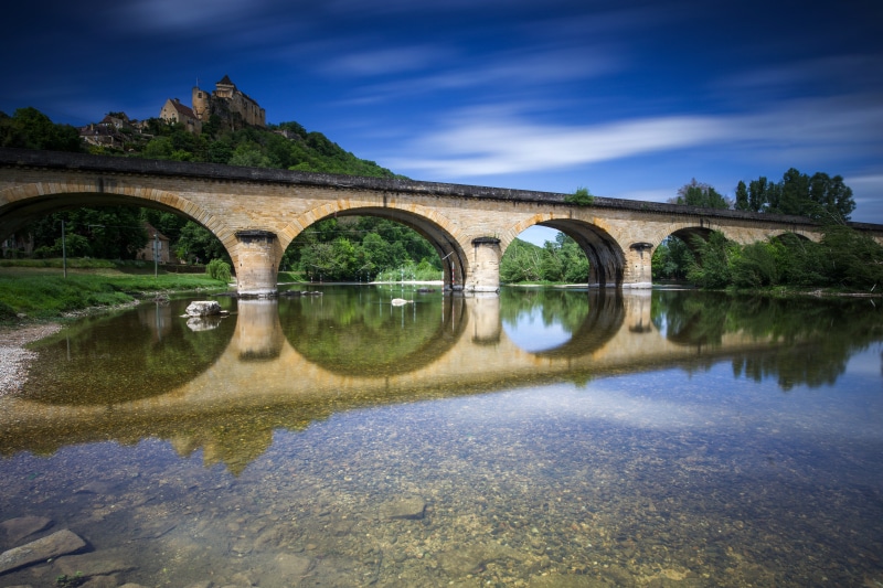 Chateau de Castelnaud bridge over a river in France