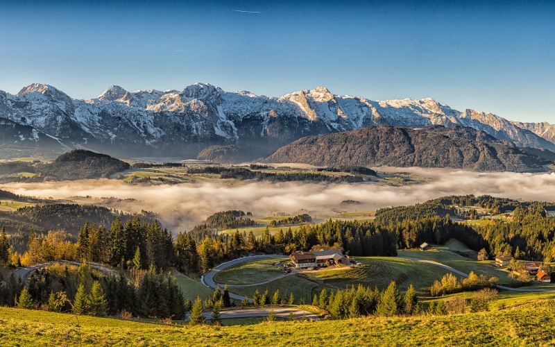 4K Austria Mountains with Houses and Fog