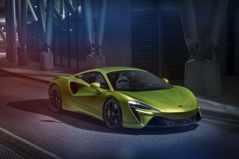 Yellow green McLaren sports car on a street