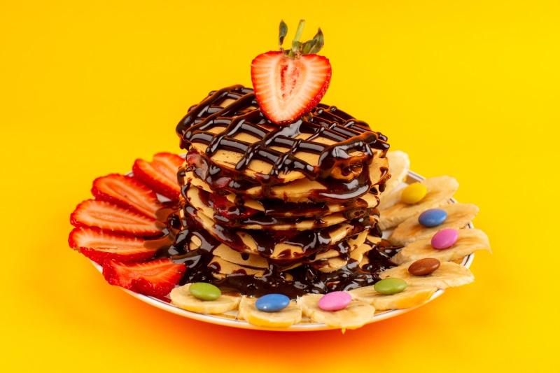 Pancakes with Chocolate, Strawberries, Bananas, and Candies