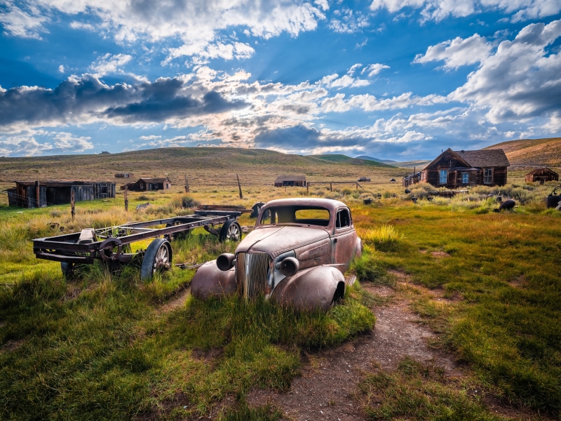 Abandoned car and buildings in Bodie State Historic Park, California
