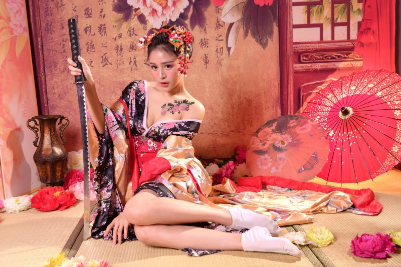 Asian woman in Kimono with Katana