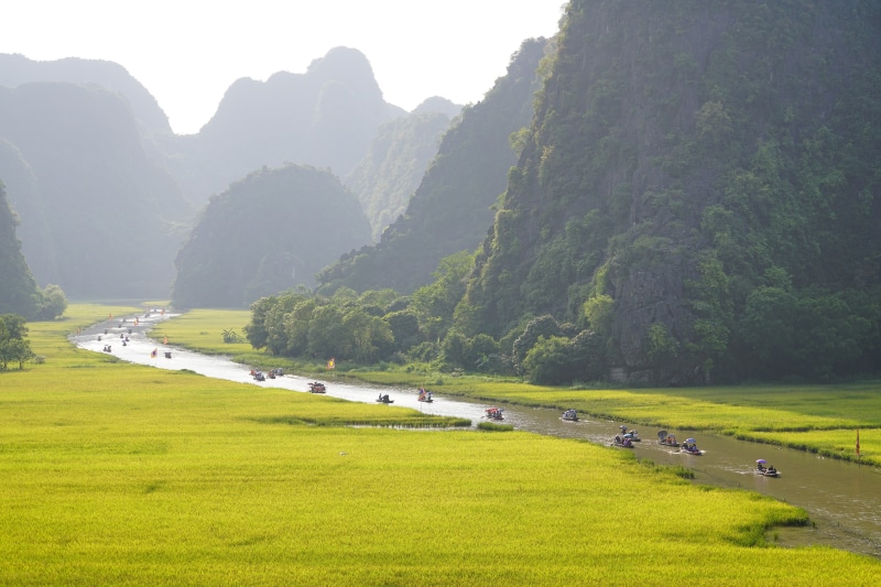 Boats on River in Tam Coc National Park, Ninh Binh, Vietnam