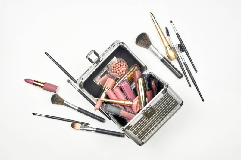 Makeup case with lipsticks and brushes