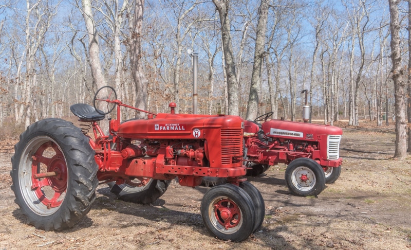 Two Red McCormick Farmall Tractors