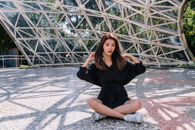 Asian woman sitting in lotus position