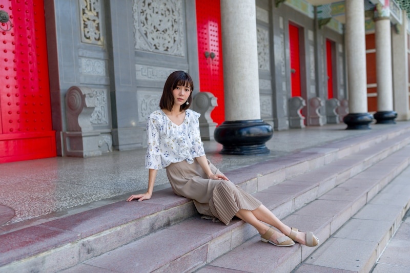 Asian Woman Sitting on Steps