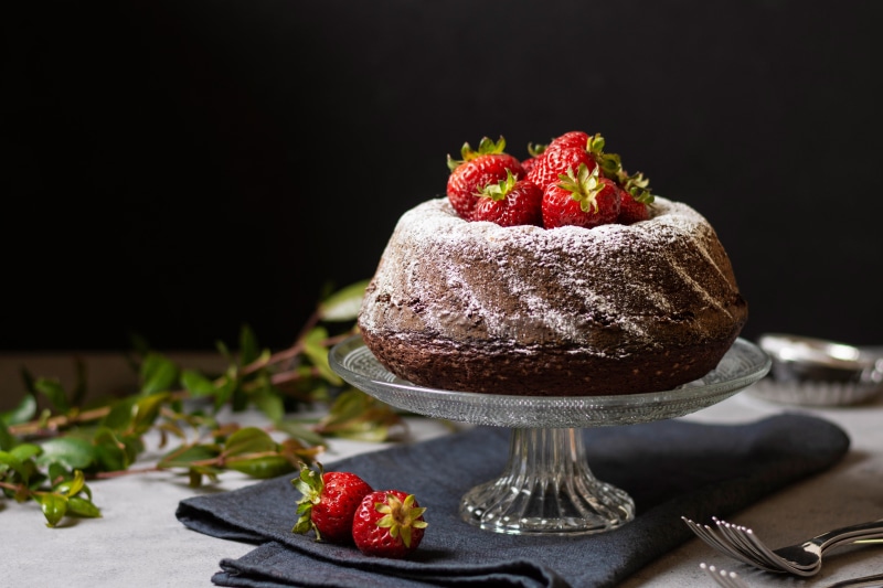 Chocolate Pound Cake with Strawberries and Powdered Sugar